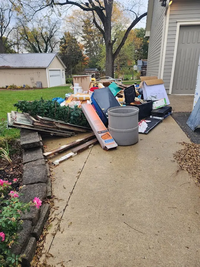 Dumpster being loaded with debris for 3 Yard Dumpster Rental in Sun City Center
